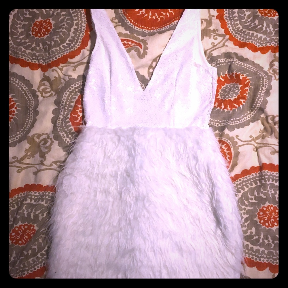White sequin and fur dress. Low cut